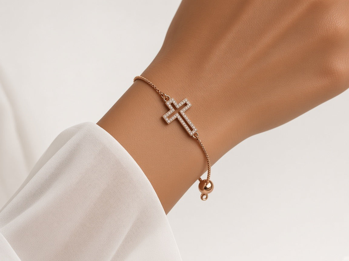 Bracelet - rose gold rhinestone cross worn by a model