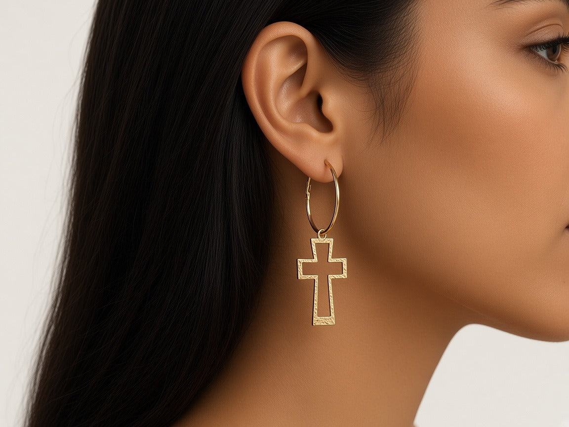 Earrings - Hollow Cross hoops - Gold worn by a model