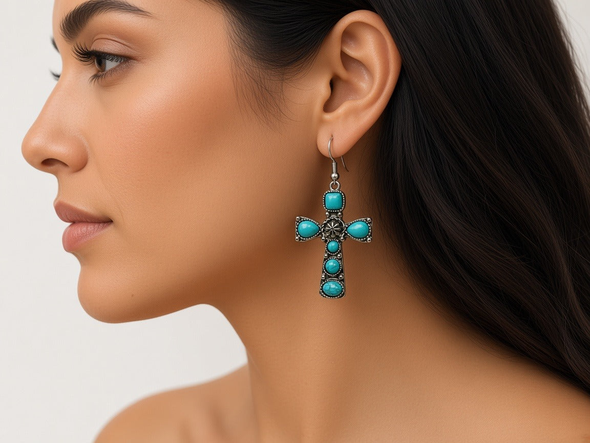 Earrings - turquoise crosses worn by a model
