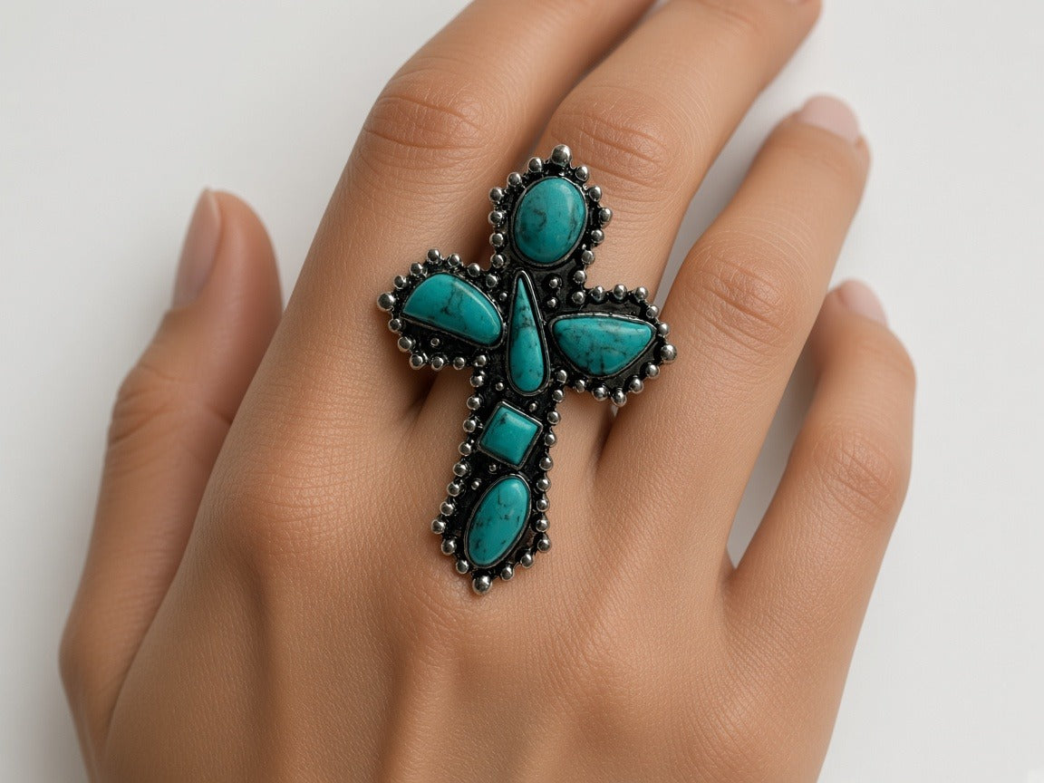 Ring - large turquoise cross ring worn by a model